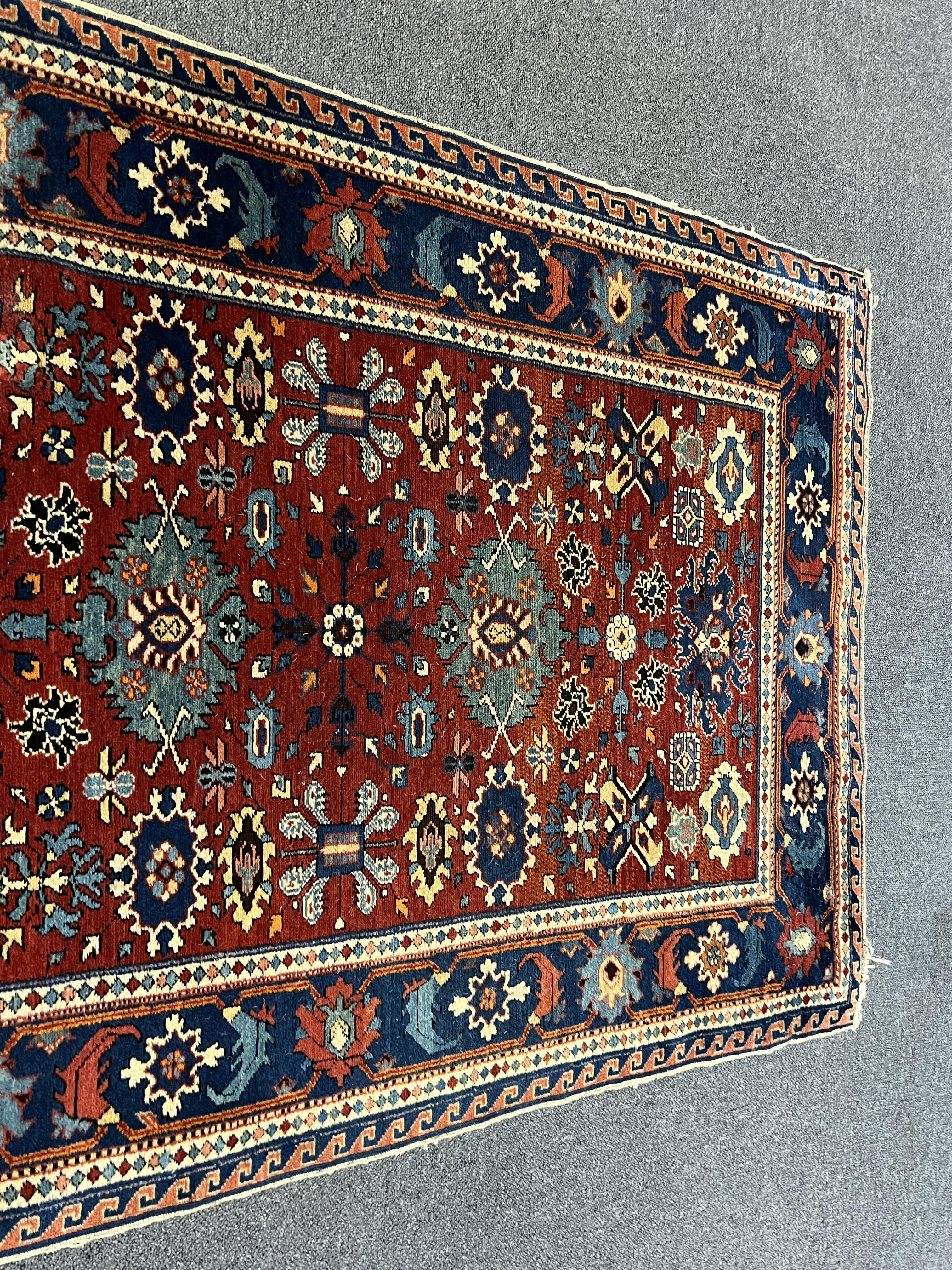 A Shiraz rug, the red field, 153 x 98cm